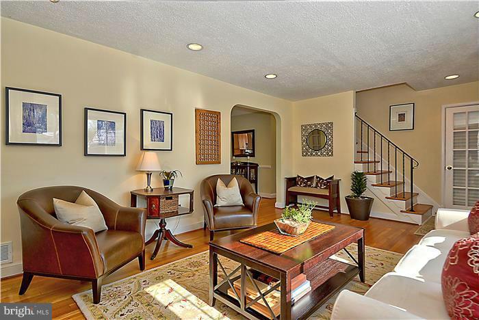 101 Hamilton Avenue Silver Spring, MD 20901 - Photo 3 of 29 a living room with furniture and wooden floor