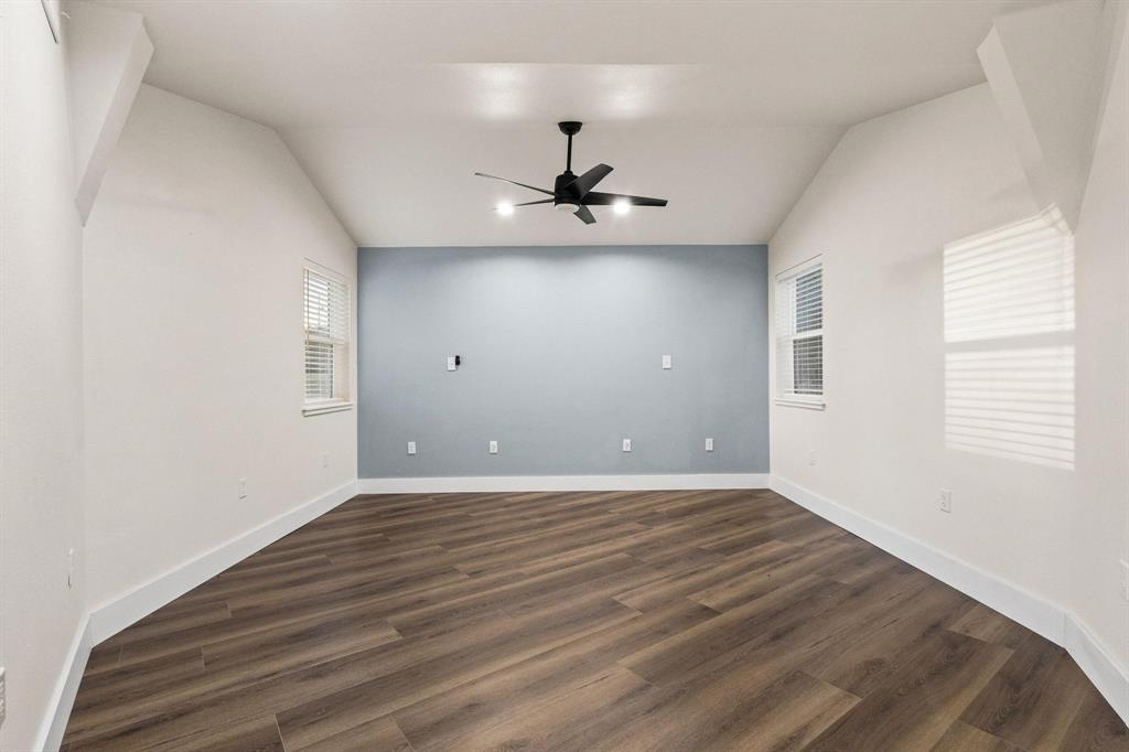 1325 Reynolds Road Whitewright, TX 75491 - Photo 12 of 39 wooden floor in an empty room with a window