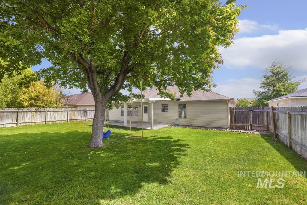 1183 Cortes Loop Twin Falls, ID 83301 - Photo 27 of 30 Spacious backyard featuring a substantial mature tree providing natural shade