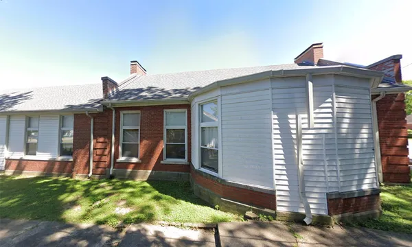 a front view of a house with a porch