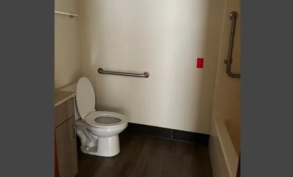 a white toilet sitting in a bathroom