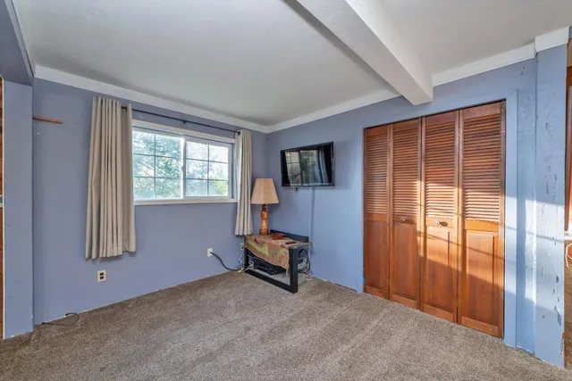 a bathroom with a shower and a sink