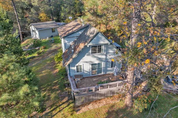 a view of a house with a tree