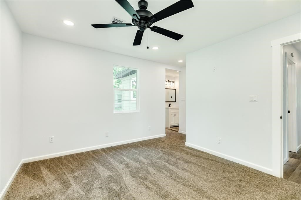 846 South Anderson Street Angleton, TX 77515 - Photo 12 of 29 an empty room with windows and fan
