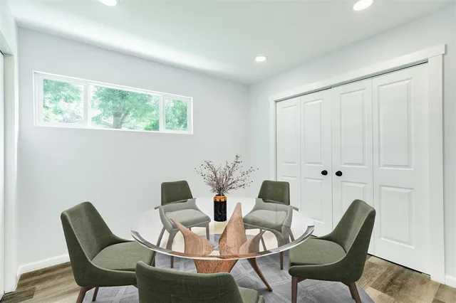 a view of a dining room with furniture and window