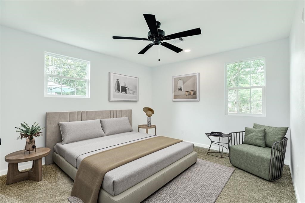 846 South Anderson Street Angleton, TX 77515 - Photo 17 of 29 a bedroom with a bed couch and window