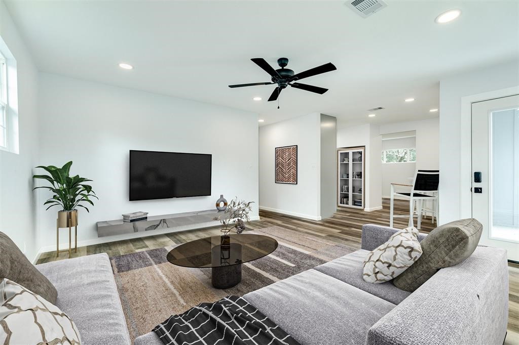846 South Anderson Street Angleton, TX 77515 - Photo 4 of 29 a living room with furniture and a flat screen tv