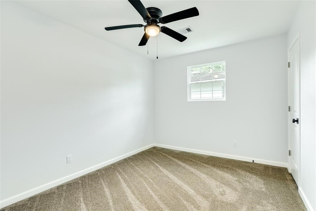 846 South Anderson Street Angleton, TX 77515 - Photo 6 of 29 an empty room with a window and a fan