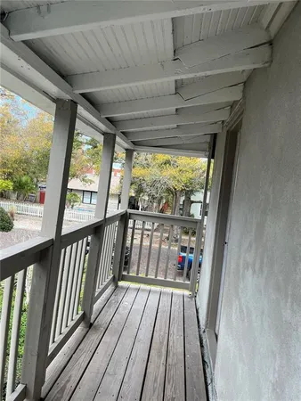 a view of hallway with wooden floor