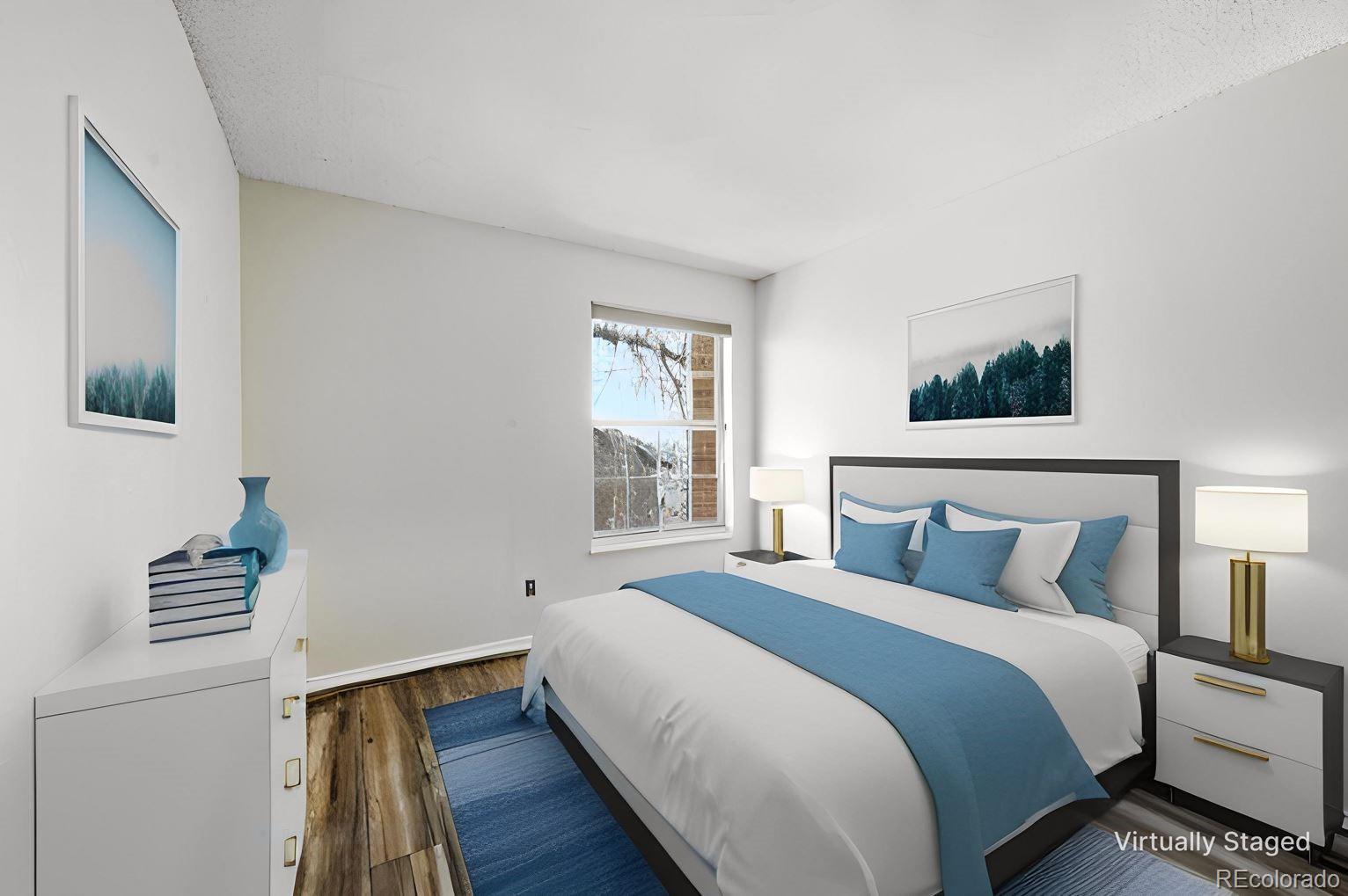 7883 Allison Way, Unit 302 Arvada, CO 80005 - Photo 18 of 29 a bedroom with a bed and a window