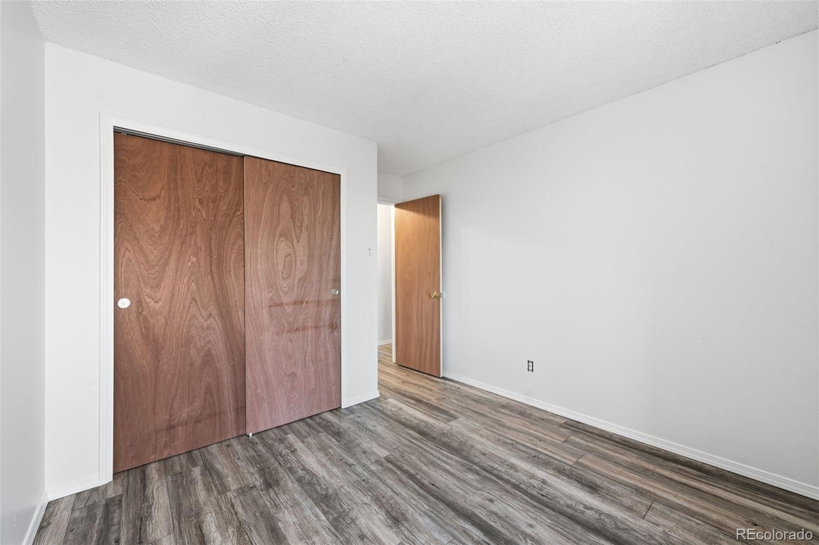 7883 Allison Way, Unit 302 Arvada, CO 80005 - Photo 21 of 29 an empty room with closet