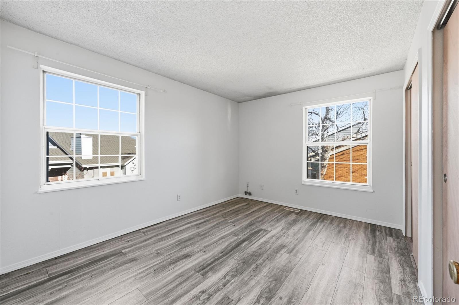 7883 Allison Way, Unit 302 Arvada, CO 80005 - Photo 22 of 29 an empty room with a window