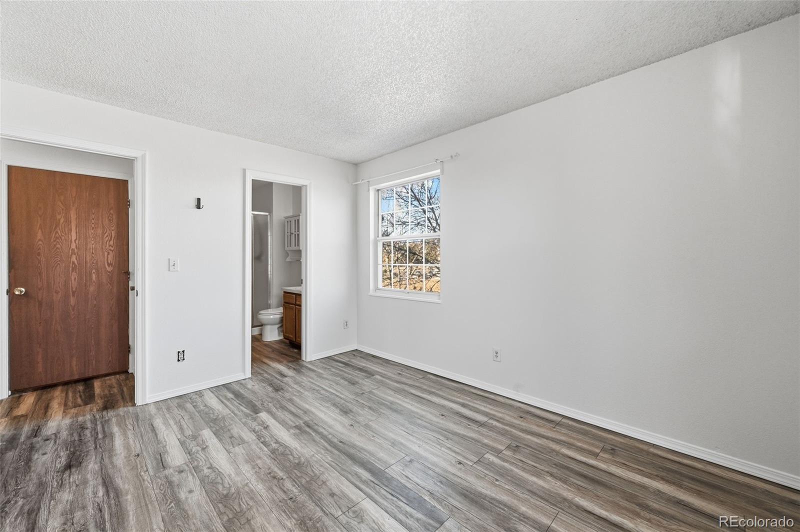 7883 Allison Way, Unit 302 Arvada, CO 80005 - Photo 24 of 29 an empty room with closet