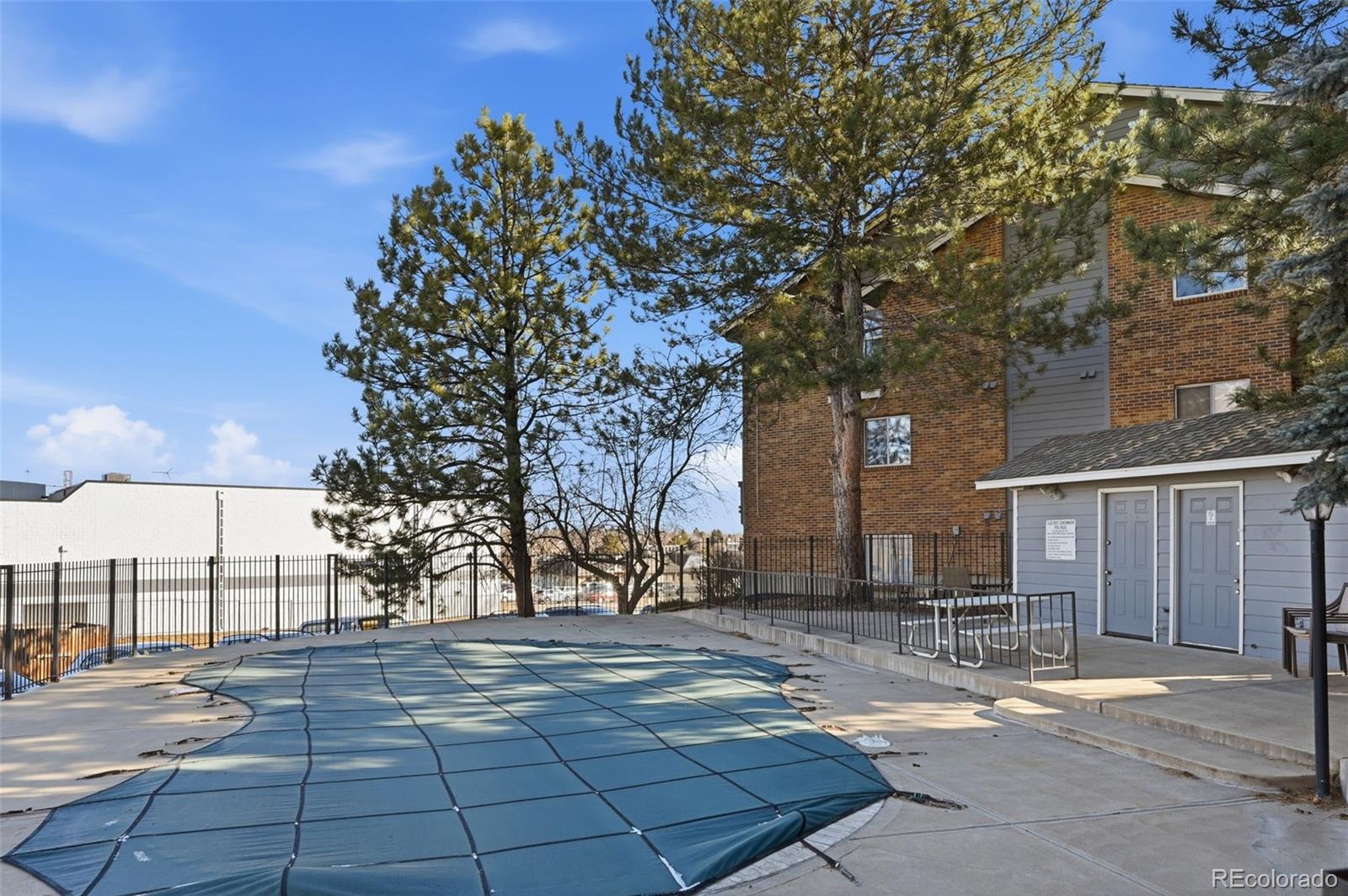 7883 Allison Way, Unit 302 Arvada, CO 80005 - Photo 28 of 29 a street view with large trees