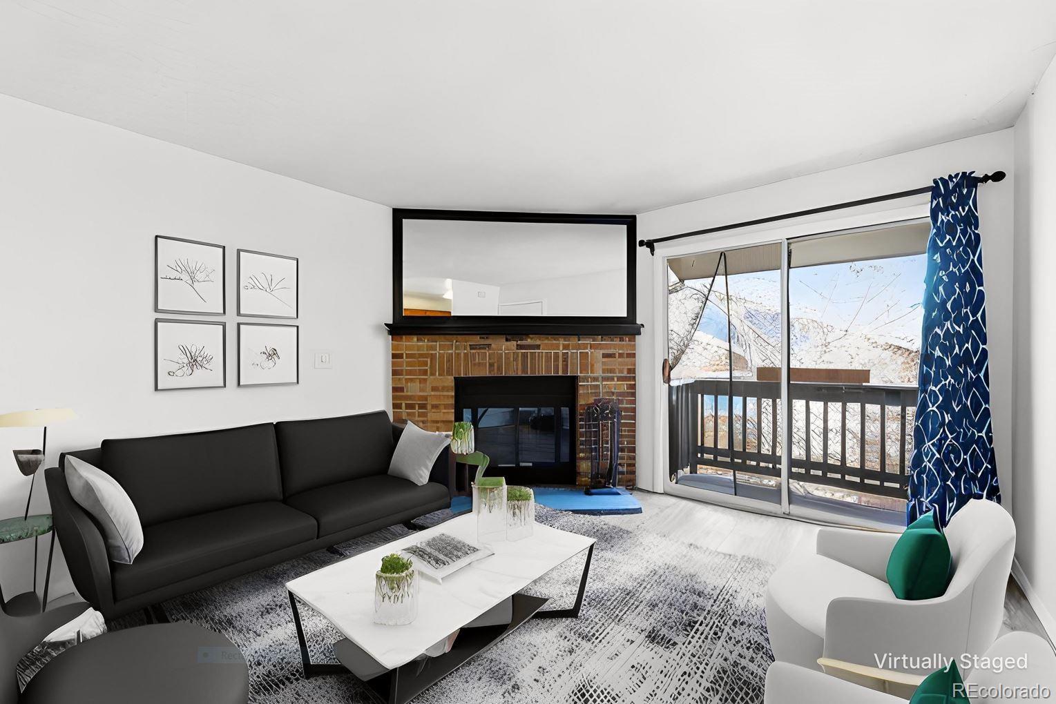 7883 Allison Way, Unit 302 Arvada, CO 80005 - Photo 5 of 29 a living room with furniture a large window and a fireplace