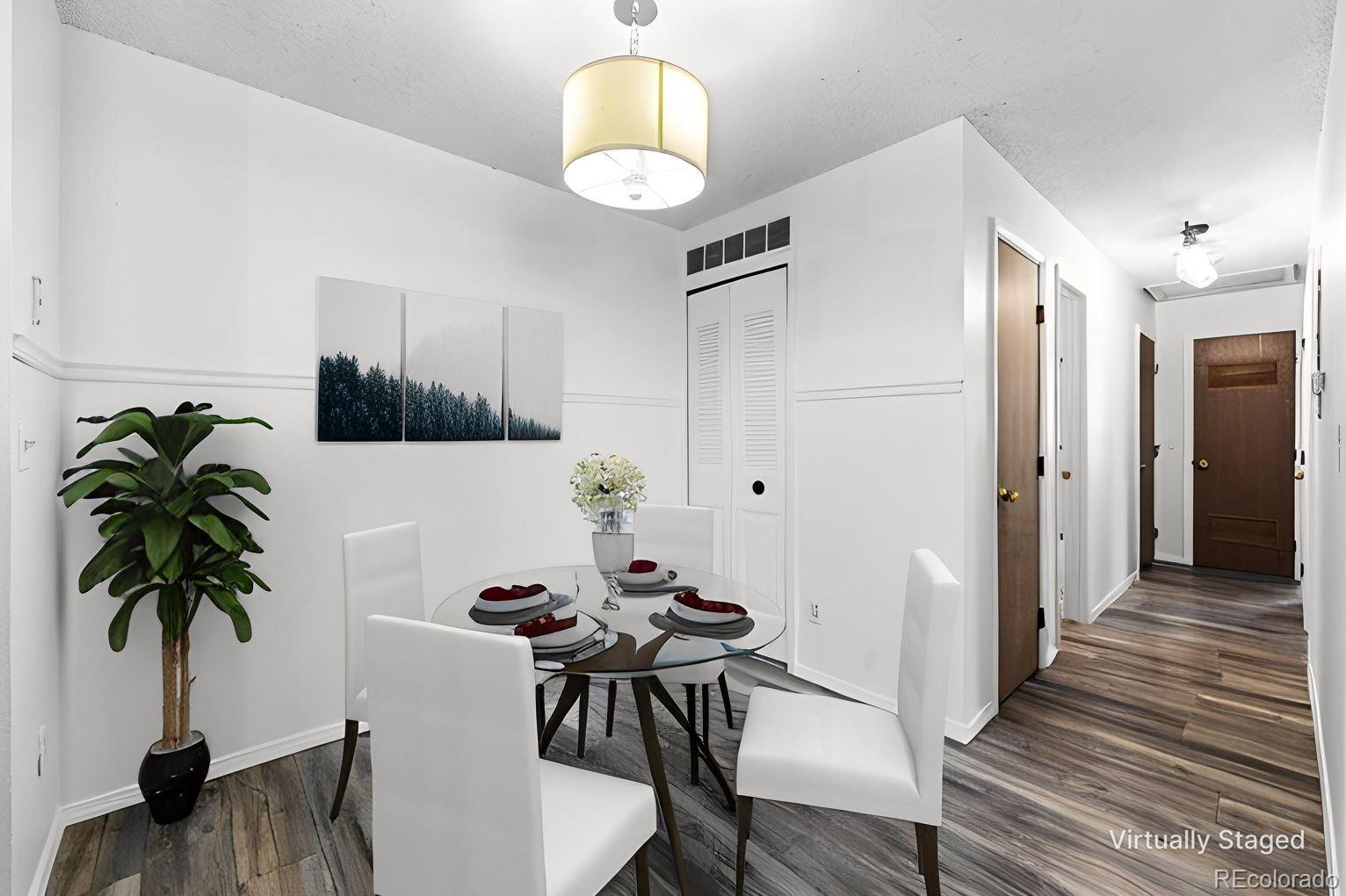 7883 Allison Way, Unit 302 Arvada, CO 80005 - Photo 9 of 29 a view of a livingroom with furniture and a potted plant