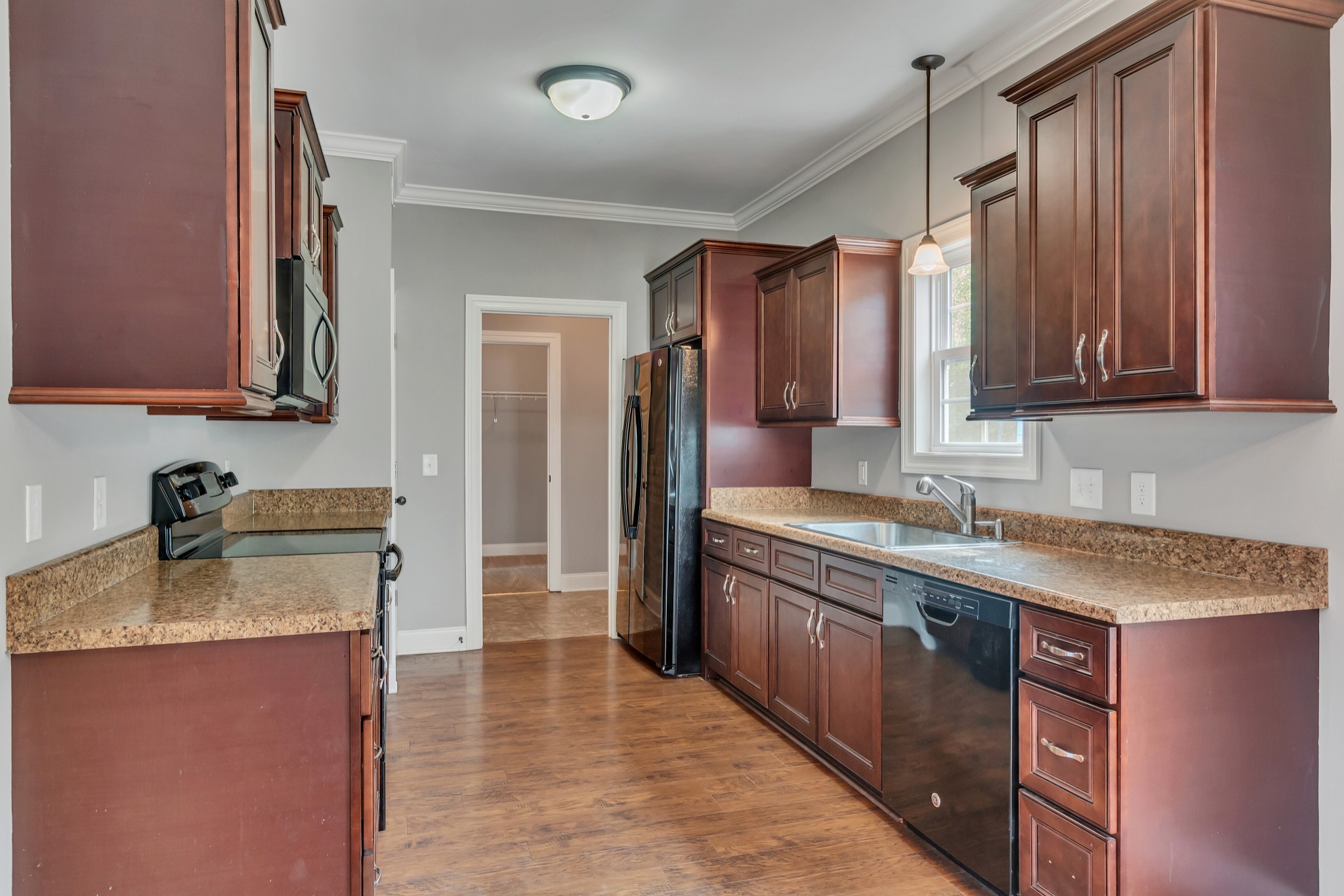 313 Drema Court Murfreesboro, TN 37127 - Photo 12 of 39 a kitchen with stainless steel appliances granite countertop a sink stove and refrigerator
