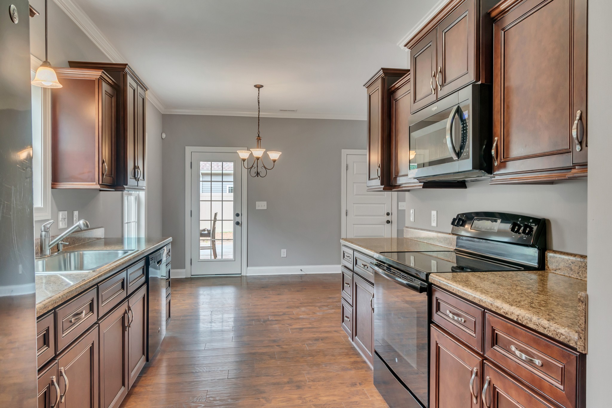 313 Drema Court Murfreesboro, TN 37127 - Photo 14 of 39 a kitchen with stainless steel appliances granite countertop a sink stove and refrigerator