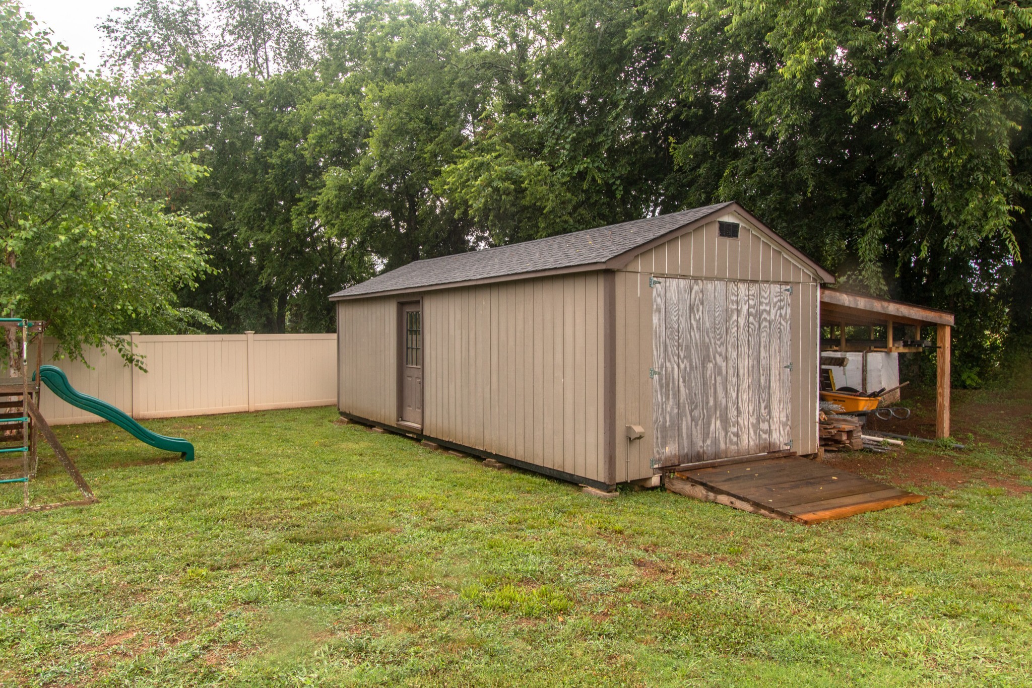 313 Drema Court Murfreesboro, TN 37127 - Photo 38 of 39 a view of a backyard with a barn