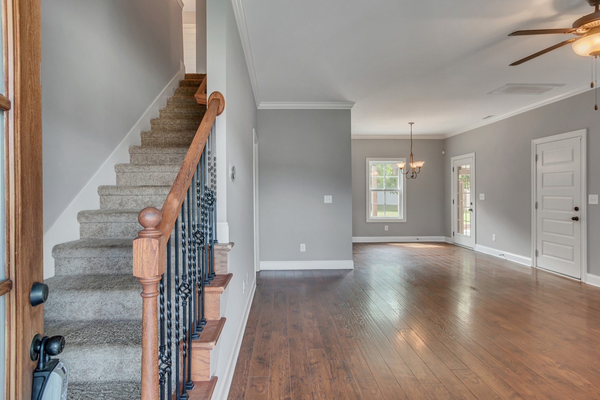 313 Drema Court Murfreesboro, TN 37127 - Photo 6 of 39 a view of a hallway with wooden floor and staircase