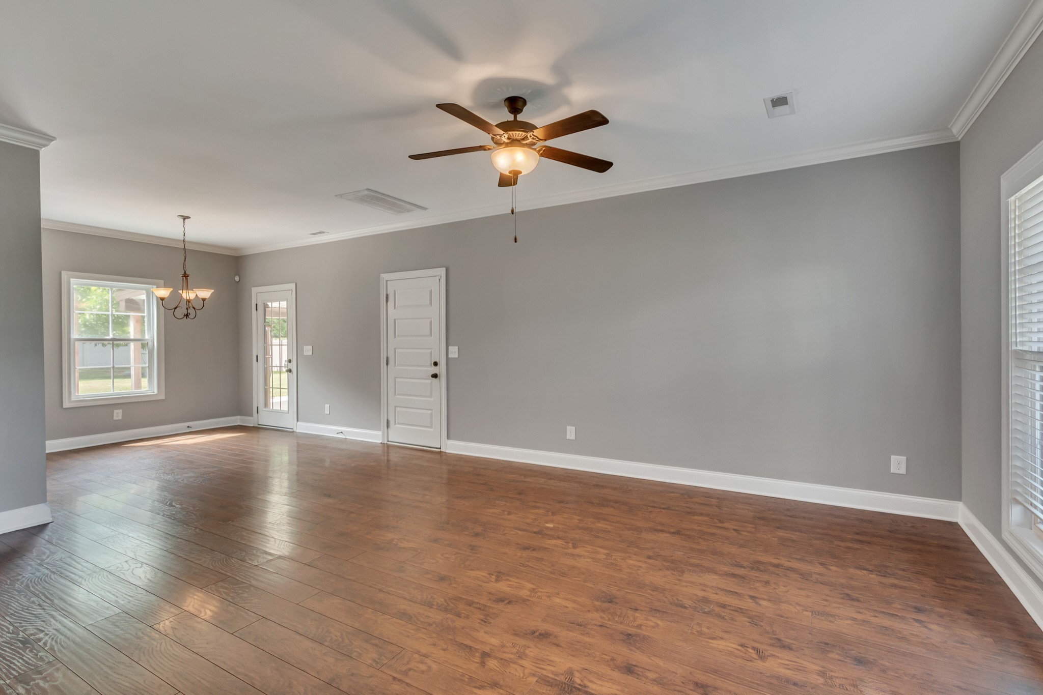 313 Drema Court Murfreesboro, TN 37127 - Photo 8 of 39 a view of an empty room with window and wooden floor
