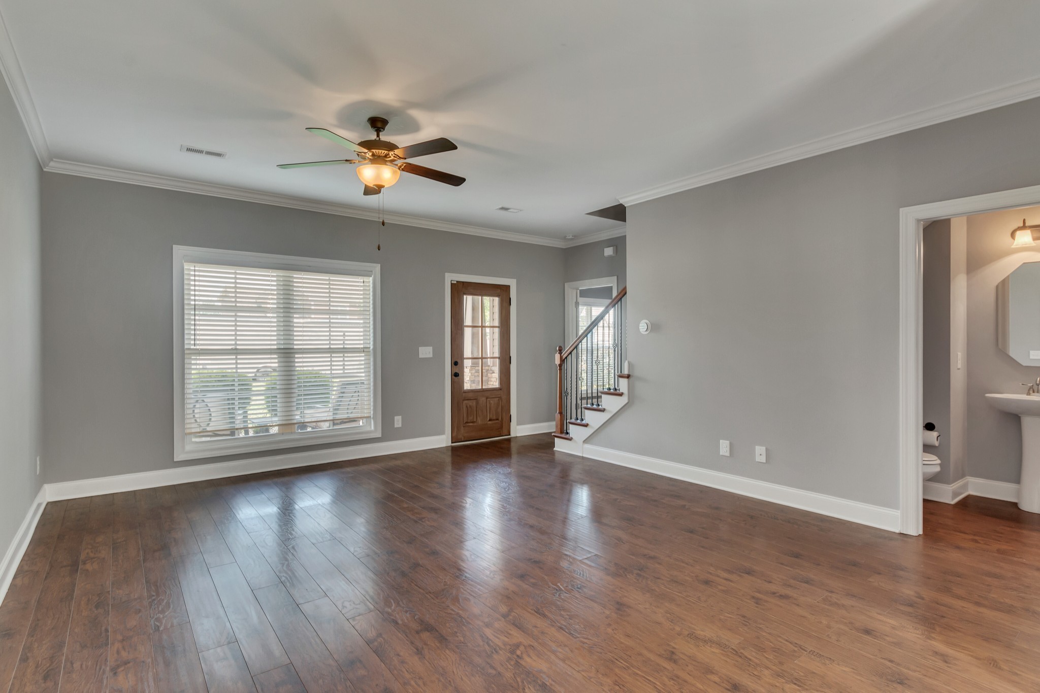 313 Drema Court Murfreesboro, TN 37127 - Photo 9 of 39 a view of an empty room with window and wooden floor