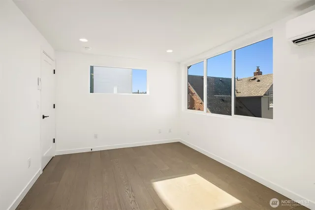 a bedroom with a bed and flat screen tv