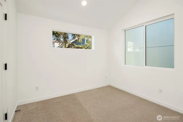 a bedroom with a bed and a chair