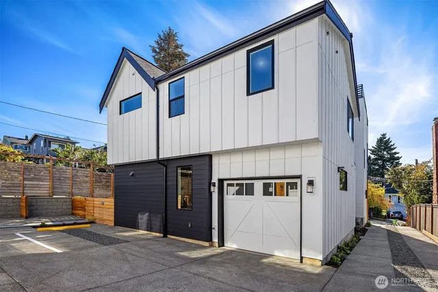 a front view of a house with garage