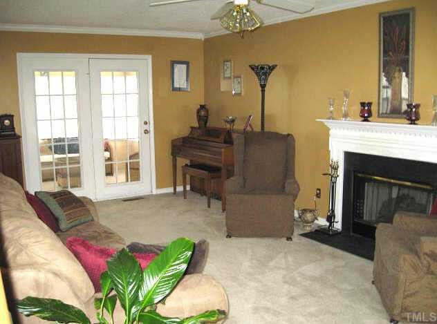 1405 Poplar Ridge Road Fuquay-Varina, NC 27526 - Photo 2 of 12 Great living room with gas log fireplace & access to sunroom Other