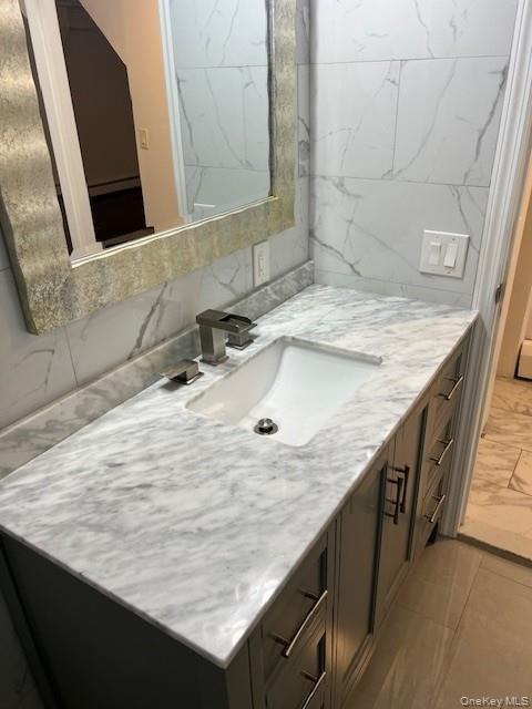 433 Palmer Road, Unit G Yonkers, NY 10701 - Photo 12 of 23 a bathroom with a granite countertop sink and a mirror