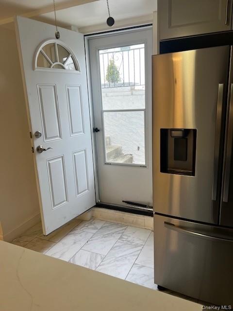 433 Palmer Road, Unit G Yonkers, NY 10701 - Photo 6 of 23 a view of a refrigerator in kitchen and entryway
