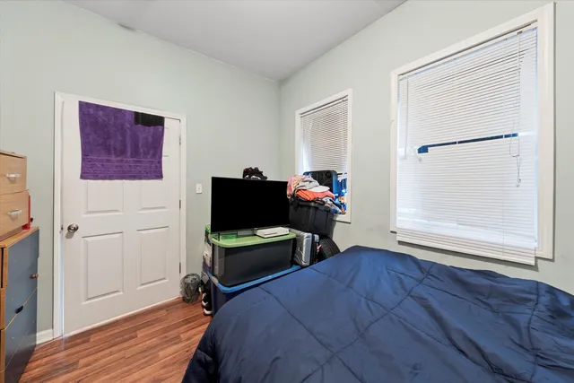 a bedroom with furniture and a window