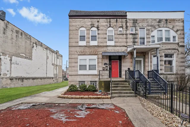 a front view of a house with garden