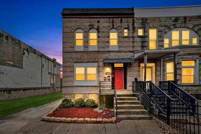 a front view of a house with a porch