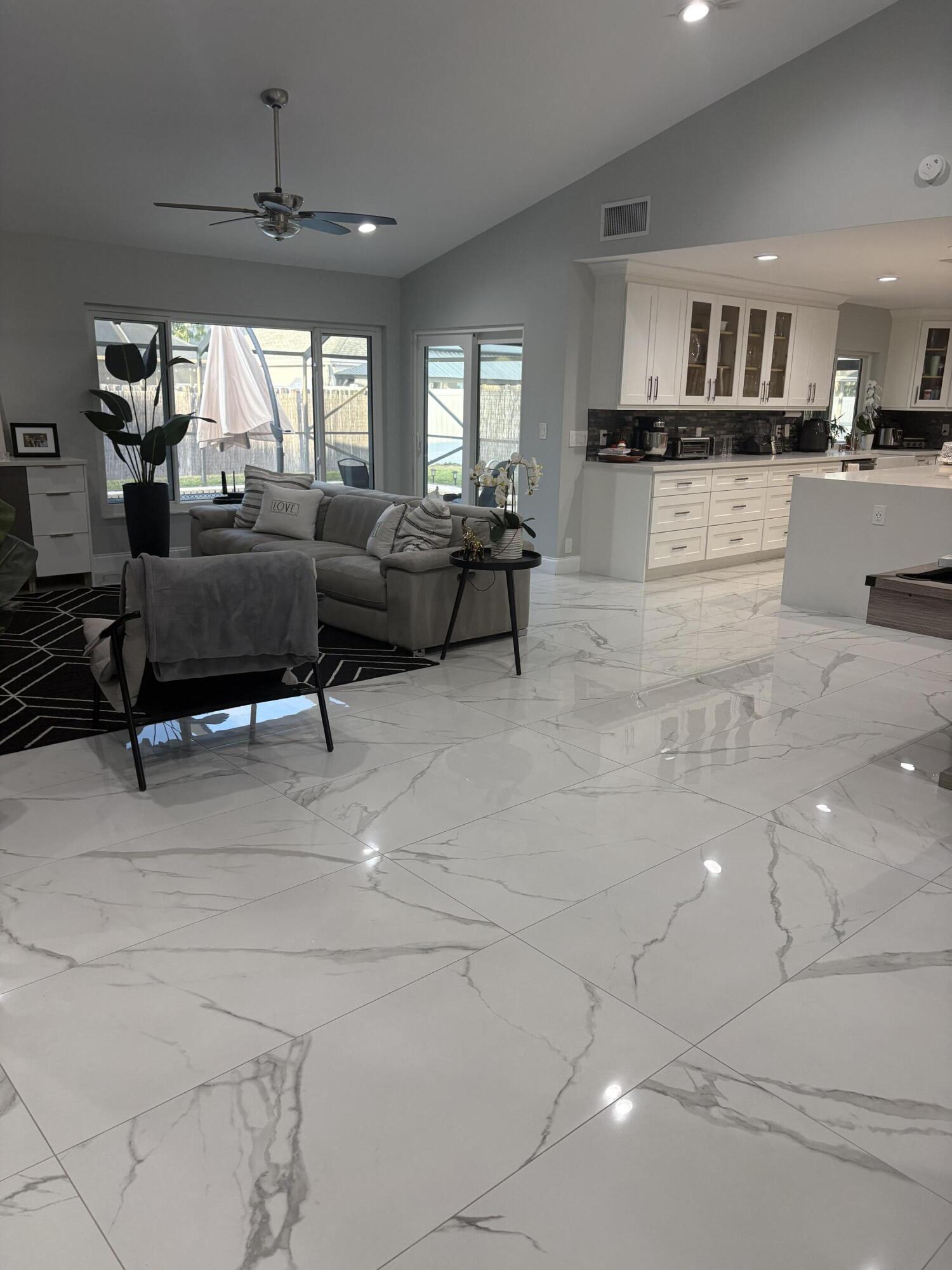 18255 181st Circle South Boca Raton, FL 33498 - Photo 3 of 15 a living room with furniture and a large window