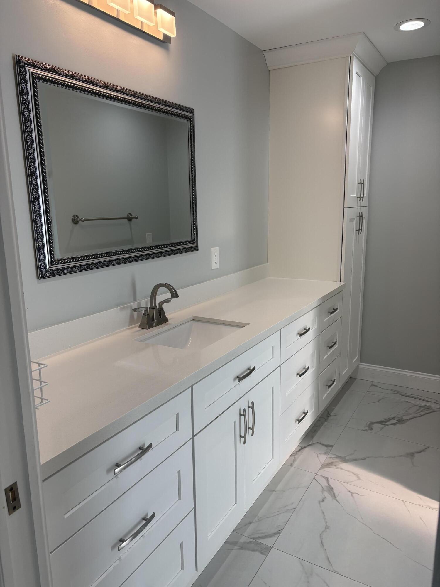 18255 181st Circle South Boca Raton, FL 33498 - Photo 7 of 16 a bathroom with double sink and mirror
