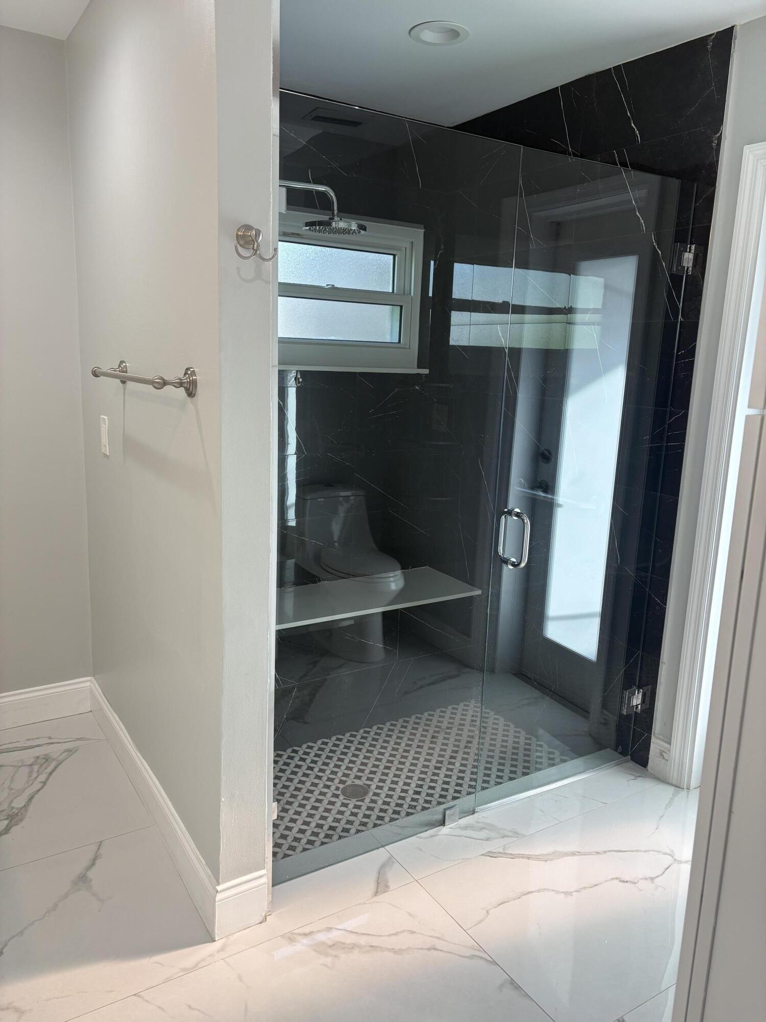 18255 181st Circle South Boca Raton, FL 33498 - Photo 8 of 16 a bathroom with a sink and mirror