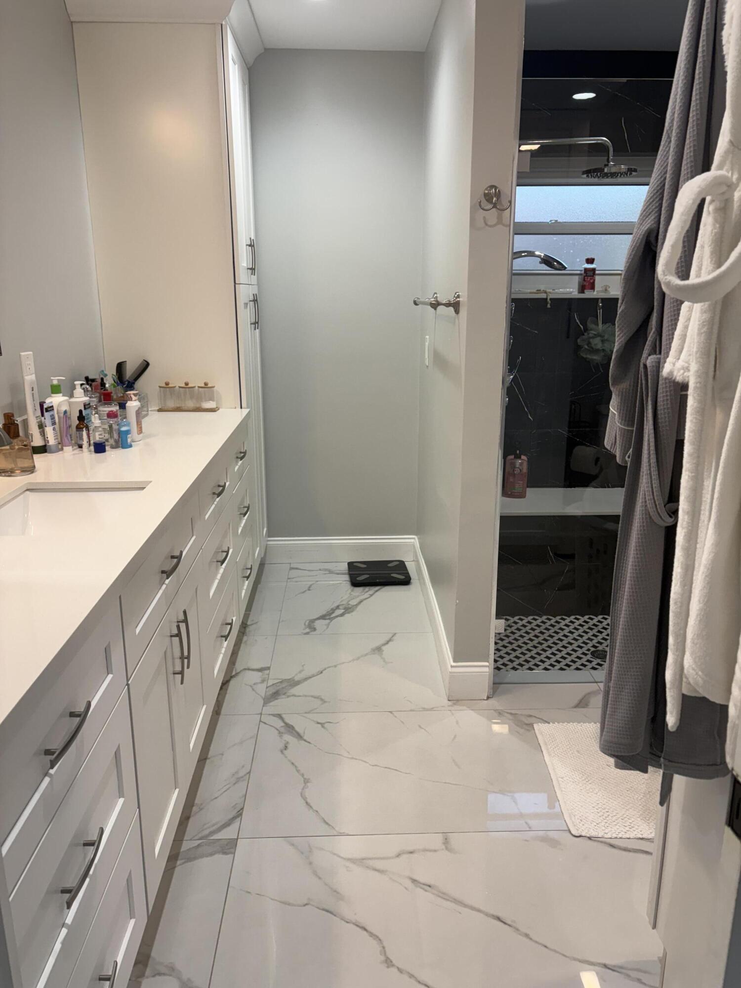 18255 181st Circle South Boca Raton, FL 33498 - Photo 10 of 15 a bathroom with a sink and mirror