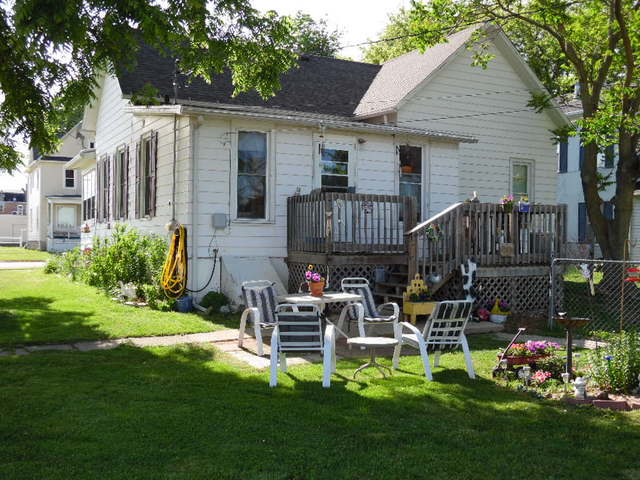 401 North 3rd Street Rochelle, IL 61068 - Photo 5 of 5 a backyard of a house with lots of green space garden and outdoor seating