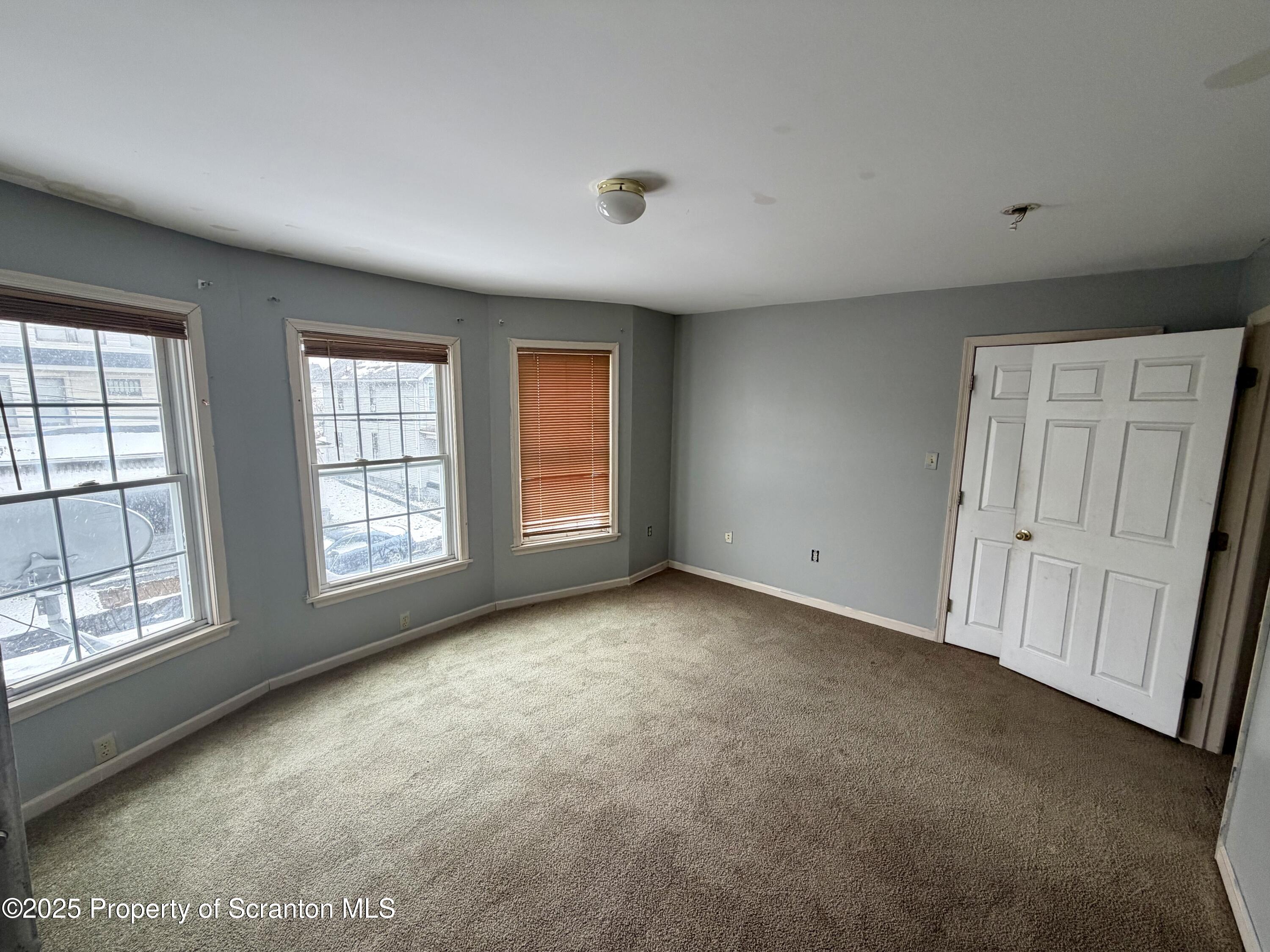 818 West Locust Street Scranton, PA 18504 - Photo 14 of 15 an empty room with windows