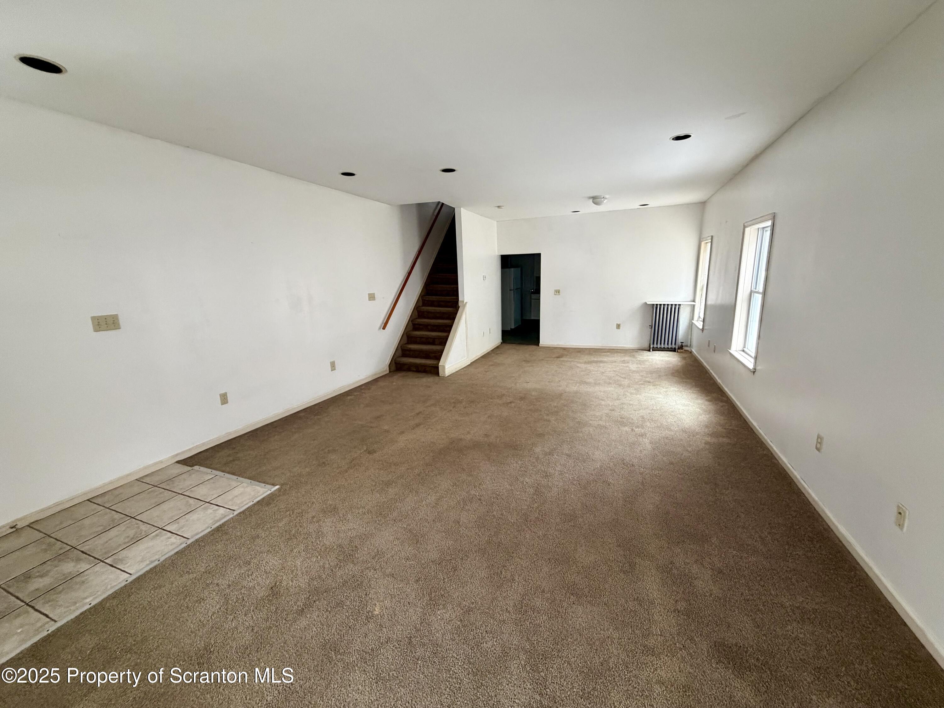 818 West Locust Street Scranton, PA 18504 - Photo 3 of 15 an empty room with windows