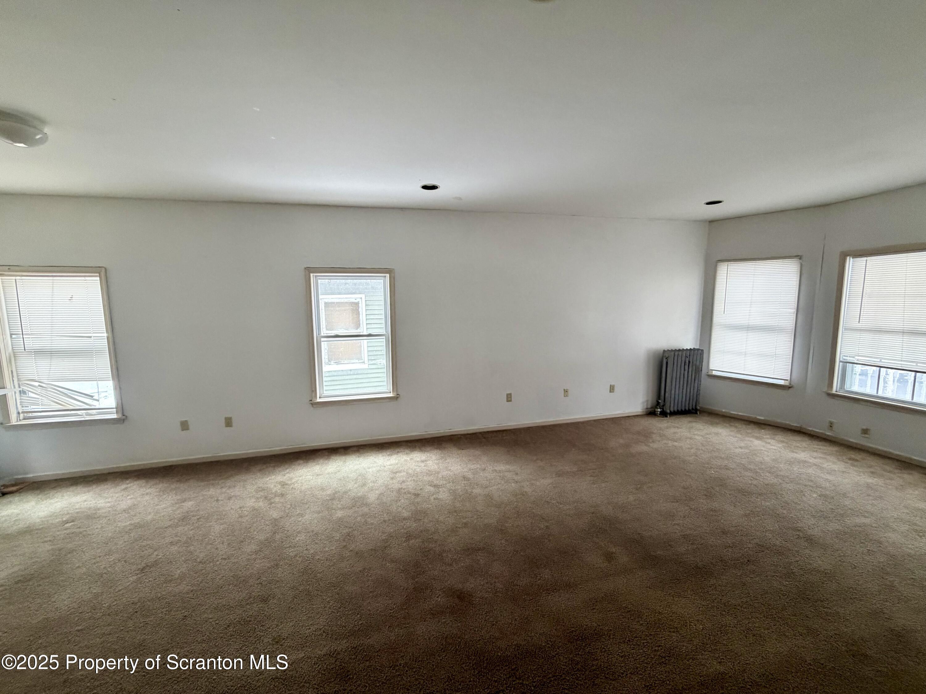 818 West Locust Street Scranton, PA 18504 - Photo 4 of 15 an empty room with windows