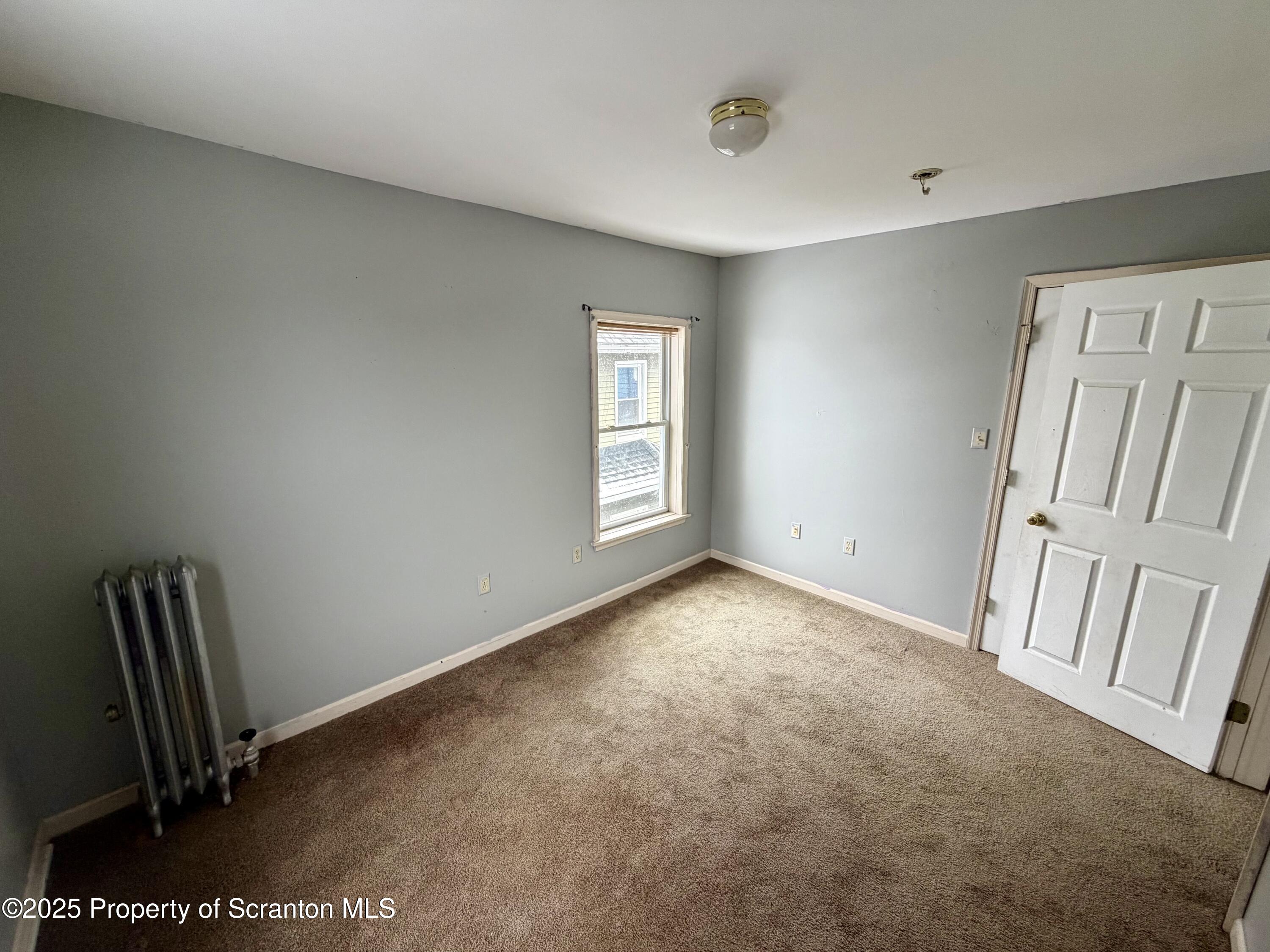 818 West Locust Street Scranton, PA 18504 - Photo 10 of 15 a view of an empty room with a window
