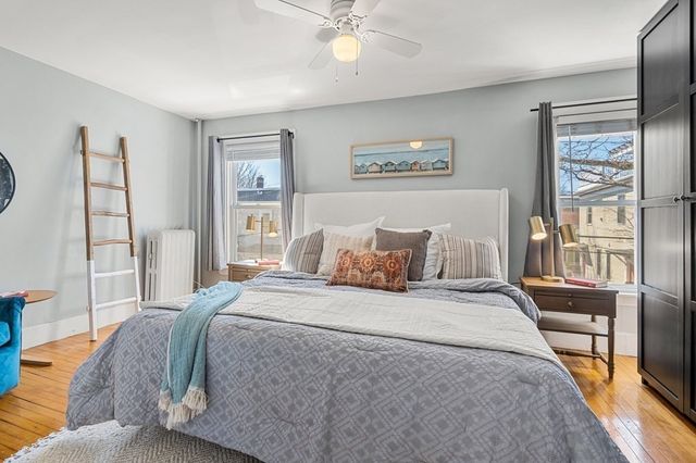 a bedroom with a large bed and a window