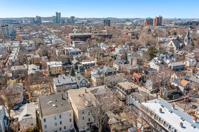 a picture of a bench in front of a wall
