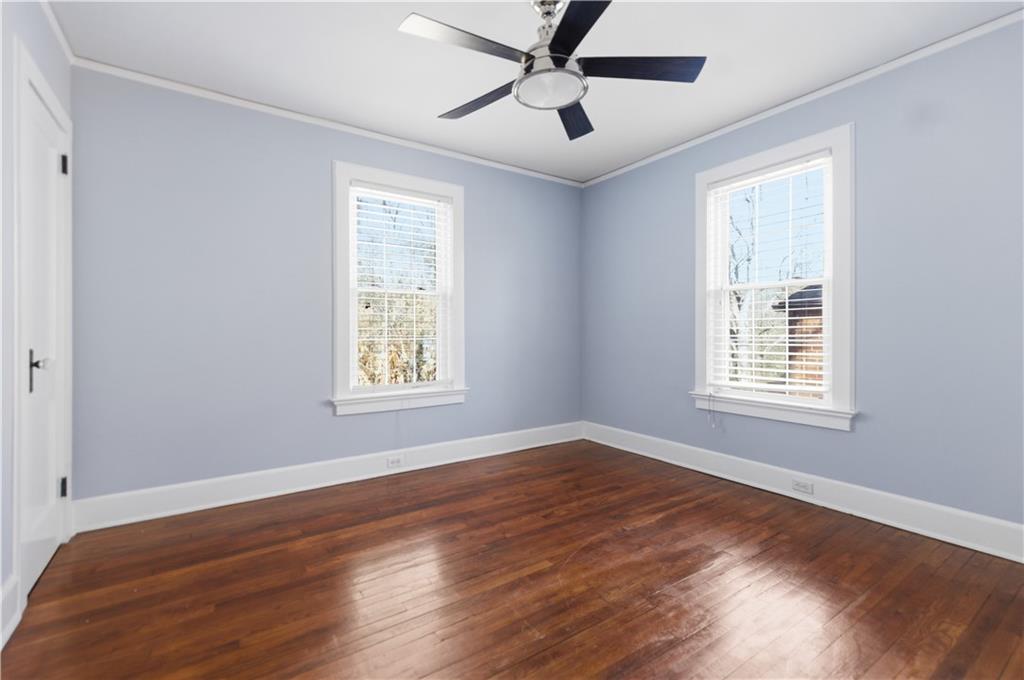1128 Scott Boulevard Decatur, GA 30030 - Photo 29 of 45 a view of an empty room with wooden floor and a window