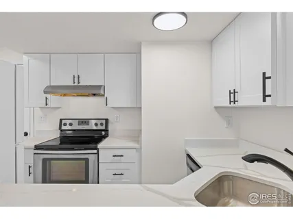 a kitchen with a stove and a microwave