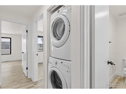 a view of a hallway with washer and dryer