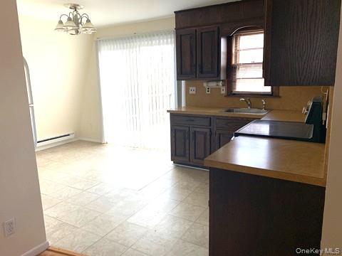 46 Cortlandt Road Mahopac, NY 10541 - Photo 26 of 32 Kitchen Dining area sliding glass doors to deck in Apartment